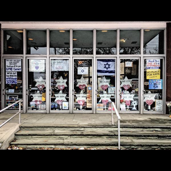 Synagogue entrance with memorial displays, include Stars of David bearing the name of October 27 victims.